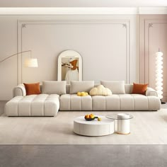 a modern living room with white furniture and orange pillows on the couches, in front of a mirror