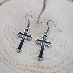 Goth/punk style Black cross earrings. Unisex. Sold as a pair. Ear hooks are made of stainless steel so are hypoallergenic. Cross pendants are made of iron and enamel and measure 36mm Comes gift wrapped 🖤 Also available as huggie hoop earrings: https://www.etsy.com/uk/listing/1263018465/gothic-cross-earrings-black-cross?click_key=1deca03ffd050172c5d7f7dd4a17533a085294c5%3A1263018465&click_sum=15aba1b1&ga_search_query=Cross&ref=shop_items_search_5&pro=1&frs=1 Handmade Punk Style Cross Jewelry, Black Cross-shaped Earrings For Gift, Black Cross Earrings As Gift, Black Cross Earrings For Gift, Gothic Cross Earrings For Pierced Ears, Nickel-free Gothic Black Plug Earrings, Gothic Cross Jewelry With Pierced Details, Pierced Gothic Cross Jewelry, Gothic Black Nickel-free Plug Earrings