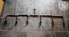 the pipes are lined up on the tiled floor