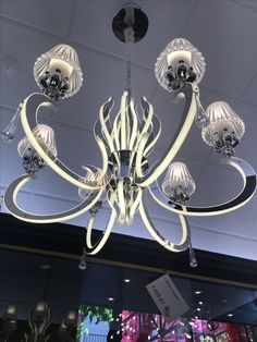 a chandelier hanging from the ceiling in a store