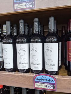 several bottles of wine on display in a store