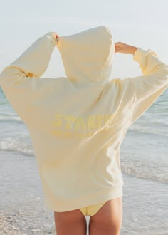 SUNSET SERIES. Blush, Sunny & Sky hoodie "Starfit" puff print on chest & "Starfit New York City" puff print on back Ultra soft, mid weight fabric. 80% cotton 20% polyester Fit: meant to be an oversized fit Models wearing size M Wash with like colors. Tumble dry low or air dry flat Cute Beachy Sweatshirts, Hoodie Small Business, Isle Of View Hoodie, Cute Clothing Brands, Light Yellow Clothes, Where To Get Hoodies, Starfit Hoodie, Good Hoodies, Preppy Hoodies