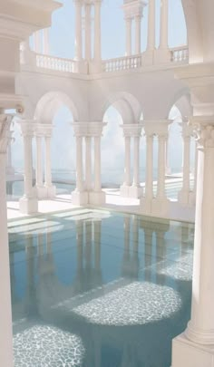 an indoor swimming pool surrounded by columns and arches with water reflecting off the floor in front of it