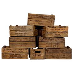 wooden crates stacked on top of each other with words written on the lids and bottom