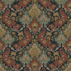 an intricately designed rug with red, green and blue colors