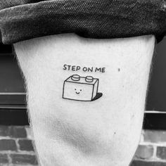 a person with a tattoo on their leg that says step on me