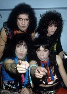 the group of rock band kiss posing for a photo