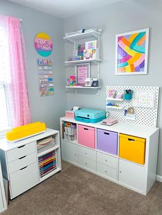 a child's room with lots of storage space and colorful accessories on the shelves