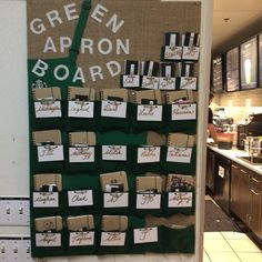 there is a green apron board on the wall