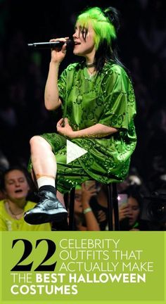 a woman with green hair sitting on top of a chair in front of a crowd