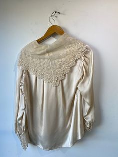 Vintage Ralph Lauren Silk and Lace Blouse. 100% Silk with lace and embroidery. Marked size 8, fits small to medium best. 24" sleeve 26" length 19" underarm to underarm Elegant Lace Patchwork Blouse For Daywear, Classic Lace Tops For Daywear, Silk Tops With Lace Trim For Daywear, Feminine Wedding Blouse With Lace Cuffs, Feminine Cream Blouse With Lace Cuffs, Elegant Blouse With Lace Cuffs For Daywear, Lace Tops With Lace Cuffs For Daywear, Elegant Lace Work Blouse For Daywear, Daywear Lace Top With Lace Cuffs