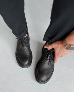 Business Oxfords With Lug Sole, Black Business Casual Leather Shoes, Black Leather Shoes For Business Casual, Classic Black Dress Shoes With Textured Sole, Timeless Black Lace-up Shoes With Rubber Sole, Masculine Black Dress Shoes For Business Casual, Masculine Round Toe Shoes For Business, Masculine Oxfords With Textured Sole, Luxury Black Moc Toe Oxfords