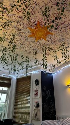 the ceiling is decorated with vines and sun lights in this living room, along with other decorations