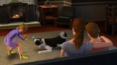 two girls are playing with a cat in front of a fireplace while another girl watches