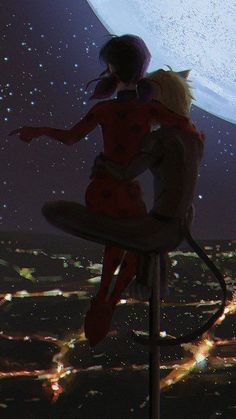 two people sitting on top of a chair looking at the stars in the night sky