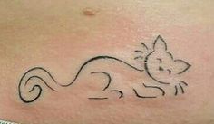 a woman's stomach with a small cat tattoo on her belly and an outline of a squirrel