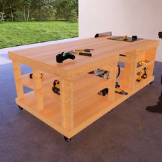 a workbench with tools on it in the middle of a room