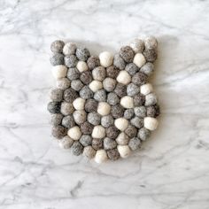 a white and gray object sitting on top of a marble counter