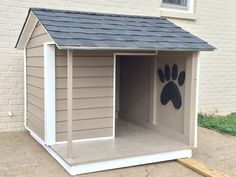 a dog house with an animal paw painted on the side