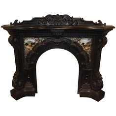 an ornately decorated fireplace mantel in black and gold