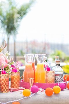 a table with drinks and decorations on it