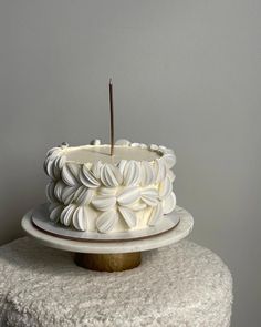 a white cake sitting on top of a table