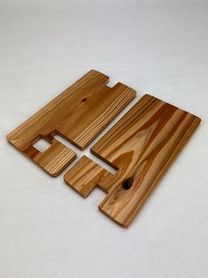 three pieces of wood sitting on top of each other