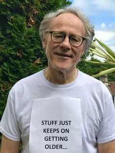 an older man with glasses and a t - shirt that says stuff just keeps on getting older