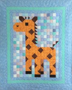 a quilted wall hanging with a giraffe on it