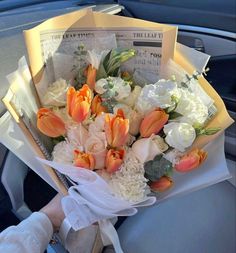 a bouquet of flowers sitting in the back seat of a car