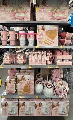 the shelves are filled with pink items for sale