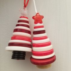 a red and white christmas tree ornament hanging from a wall