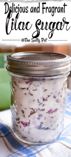 a jar filled with white sugar sitting on top of a blue and white checkered table cloth