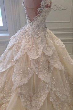 a ball gown with white flowers on it