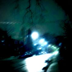 a blurry photo of a street light at night