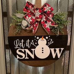 a door hanger that says let it snow