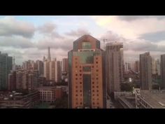 an aerial view of a city with tall buildings