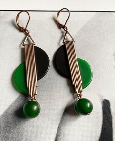 "Stunning pair of Art Deco earrings  Black & Deep Green bakelite  geometric panels finished with matching Green bakelite dangle bead Rose gold-Coppery Metal finish , which contrasts very well with the green - looks very Deco ! After the style of Jakob Bengel and similar Continental/European Modernist jewellery of the 1920s- 1930s period each pair of earrings are unique & are reworked with original vintage bakelite & galalith from my own collection. I will only make a few pairs in each colour/des Flapper Jewelry, Art Deco Jewelry 1920s, Art Deco Jewellery Design, Art Deco Jewelry Vintage, Jazz Age, Modernist Jewelry, Acrylic Jewellery, Art Deco Earrings, Creative Jewelry