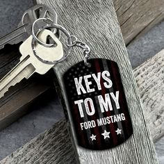 a keychain that says keys to my ford mustang with stars and stripes on it