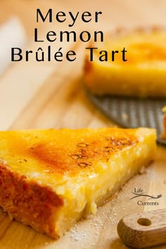 a piece of lemon brulee tart sitting on top of a wooden cutting board