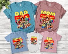 three t - shirts that say dad, birthday boy and sister are in front of them