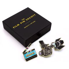 a box with two pins and a camera on it