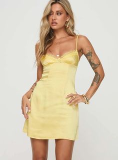 Satin mini dress Adjustable shoulder straps, v-neckline, lace trim, invisible zip fastening down back Non-stretch material, lined bust Princess Polly Lower Impact 100% reclaimed polyester  Cold hand wash Yellow Mini Dress Outfit, Light Yellow Hoco Dress, Yellow Hoco Dress, Short Yellow Dress, Cute Hoco Dresses, Red Summer Dresses, Yellow Mini Dress, Fringe Mini Dress, Mini Dress Outfits