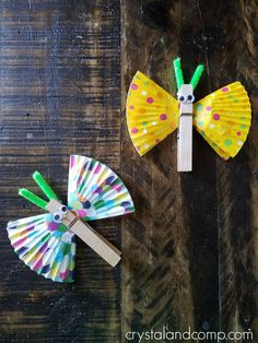 two paper crafts made to look like butterfly wings