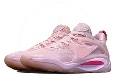 a pair of pink sneakers on a white background