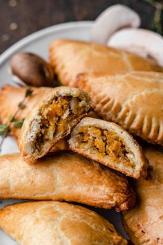 several pastries on a plate with nuts and herbs