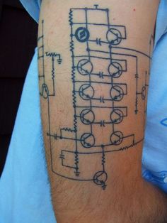 a man with a tattoo on his arm has a circuit diagram tattooed on it's leg