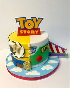 a toy story themed cake is on display