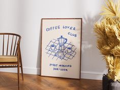 a coffee lover's club poster on the wall next to a chair and potted plant