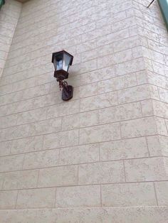 a street light on the side of a building